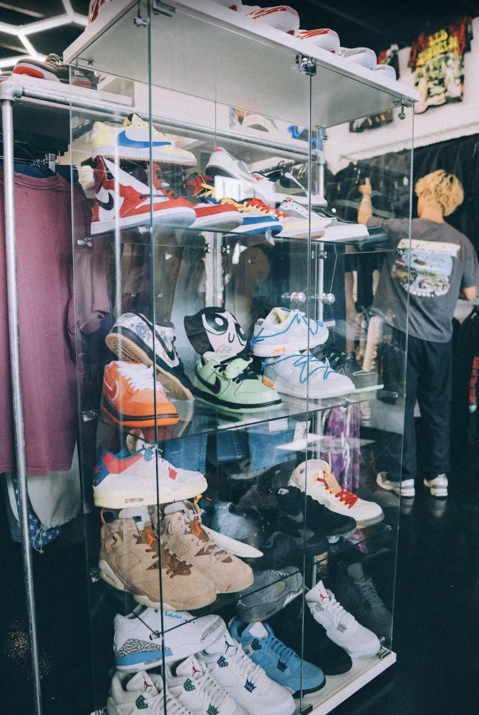 Glass case stacked with Dunks and Jordans